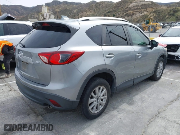 2014 Mazda CX-5 Touring with VIN JM3KE2CY3E0429025, listed as a IAAI auction lot 41680713 with 113,065 mi miles. Bid and sale history available at carsss.com. Image 4.