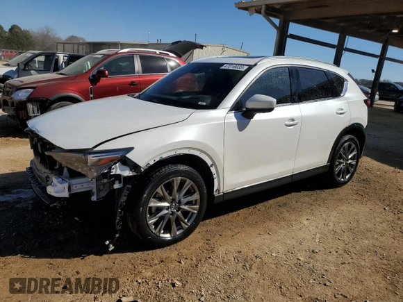 2021 Mazda CX-5 Signature with VIN JM3KFBEY5M0352778, listed as a Copart auction lot 47016035 with 37,961 mi miles and Salvage Title. Bid and sale history available at carsss.com. Image 1.