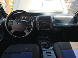 2005 Ford Ranger XLT z VIN 1FTZR45E05PA33894, wystawiony jako Copart lot #60548815 z przebiegiem 154 796 mil mil oraz Czysty tytuł • Clean title. Historia ofert i sprzedaży dostępna na DreamBid. Obrazek 9.