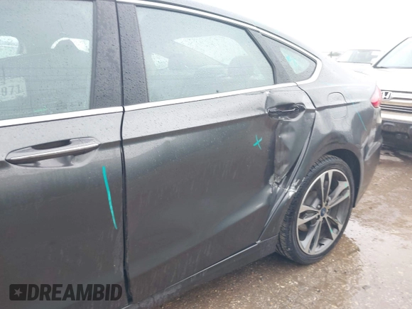 2020 Ford Fusion Titanium with VIN 3FA6P0K97LR192657, listed as a IAAI auction lot 42170258 with 87,696 mi miles and . Bid and sale history available at DreamBid. Image 18.