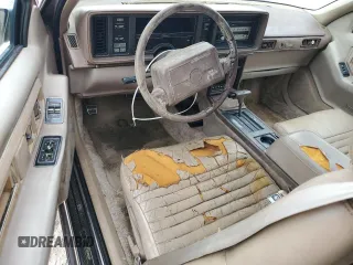 1991 Cadillac Eldorado z VIN 1G6EL13B4MU604636, wystawiony jako Copart lot #79155234 z przebiegiem Nie podano mil oraz Nie do naprawy. Historia ofert i sprzedaży dostępna na DreamBid. Obrazek 8.