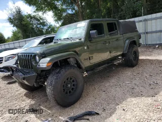 2021 Jeep Gladiator Sport S z VIN 1C6JJTAM1ML557628, wystawiony jako Copart lot #60080104 z przebiegiem 38 599 mil mil oraz Szkody całkowita. Historia ofert i sprzedaży dostępna na DreamBid. Obrazek 1.
