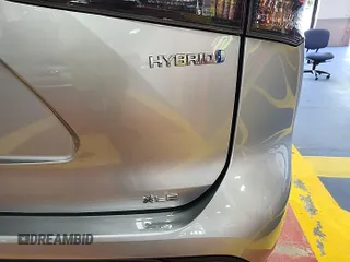 2021 Toyota Highlander Hybrid XLE z VIN 5TDHBRCH2MS535613, wystawiony jako IAAI lot #42569661 z przebiegiem 115 704 mil mil oraz . Historia ofert i sprzedaży dostępna na DreamBid. Obrazek 1.