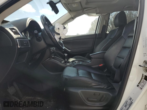 2016 Mazda CX-5 Grand Touring z VIN JM3KE2DY9G0645141, wystawiony jako Copart lot #50989635 z przebiegiem 123 898 mil mil oraz Szkoda całkowita • Salvage title. Historia ofert i sprzedaży dostępna na DreamBid. Obrazek 7.