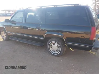 1999 GMC Suburban with VIN 3GKEC16R6XG549656, listed as a IAAI auction lot 41403259 with 306,548 mi miles. Bid and sale history available at carsss.com. Image 3.