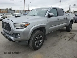 2018 Toyota Tacoma SR5 with VIN 3TMBZ5DNXJM012897, listed as a Copart auction lot 58811915 with 86,290 mi miles and Salvage title. Bid and sale history available at DreamBid. Image 1.