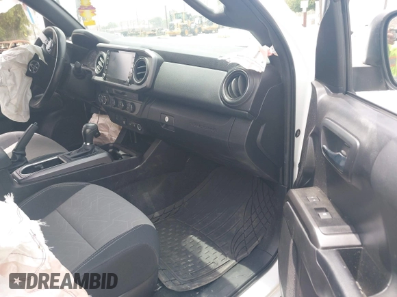 2023 Toyota Tacoma SR with VIN 3TMCZ5AN1PM556299, listed as a IAAI auction lot 42344160 with 42,338 mi miles and . Bid and sale history available at DreamBid. Image 5.