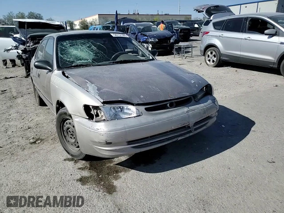 1999 Toyota Corolla VE with VIN 1NXBR12E9XZ158252, listed as a Copart auction lot 58757595 with 232,776 mi miles and Salvage title. Bid and sale history available at DreamBid. Image 14.