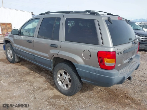1999 Jeep Grand Cherokee Laredo with VIN 1J4GW58S6XC613307, listed as a IAAI auction lot 41592687 with 264,176 mi miles. Bid and sale history available at carsss.com. Image 3.