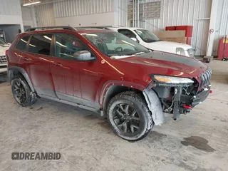 2016 Jeep Cherokee Trailhawk with VIN 1C4PJMBBXGW135138, listed as a IAAI auction lot 41595718 with 267,058 mi miles. Bid and sale history available at carsss.com. Image 1.