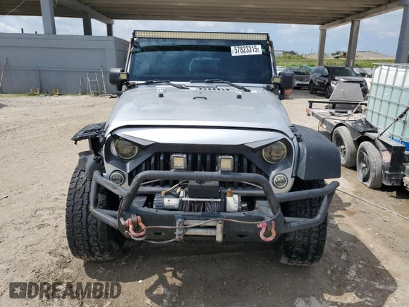 2012 Jeep Wrangler Unlimited Sport z VIN 1C4BJWDG8CL220960, wystawiony jako Copart lot #57823315 z przebiegiem 177 541 mil mil oraz Szkoda całkowita • Salvage title. Historia ofert i sprzedaży dostępna na DreamBid. Obrazek 5.