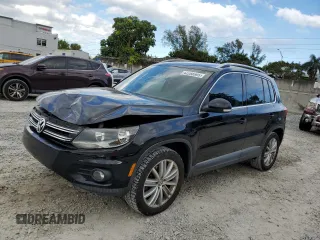 2014 Volkswagen Tiguan SE z VIN WVGAV3AXXEW543245, wystawiony jako Copart lot #42288905 z przebiegiem 92 851 mil mil oraz Szkoda całkowita • Salvage title. Historia ofert i sprzedaży dostępna na DreamBid. Obrazek 1.