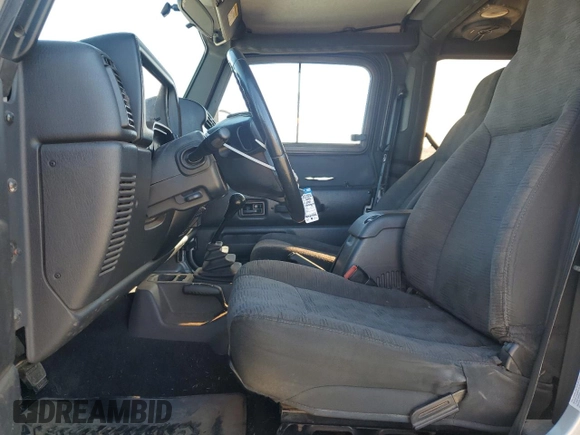 2003 Jeep Wrangler Rubicon z VIN 1J4FA69SX3P301962, wystawiony jako Copart lot #79928744 z przebiegiem Nie podano mil oraz Czysty tytuł • Clean title. Historia ofert i sprzedaży dostępna na DreamBid. Obrazek 7.
