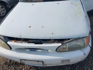 1997 Ford Escort LX with VIN 3FALP15P1VR124828, listed as a IAAI auction lot 42128530 with Not Provided miles and . Bid and sale history available at DreamBid. Image 10.