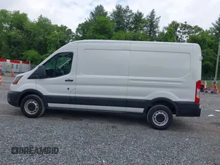 2022 Ford Transit Cargo with VIN 1FTBR1C85NKA74578, listed as a IAAI auction lot 42316744 with 63,376 mi miles and . Bid and sale history available at DreamBid. Image 14.