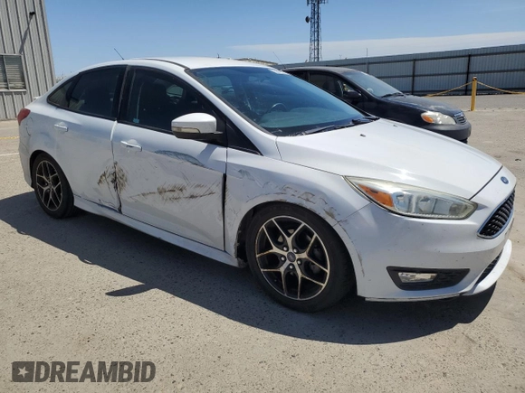 2016 Ford Focus SE with VIN 1FADP3F22GL329241, listed as a Copart auction lot 58095135 with 105,079 mi miles and Salvage title. Bid and sale history available at DreamBid. Image 4.