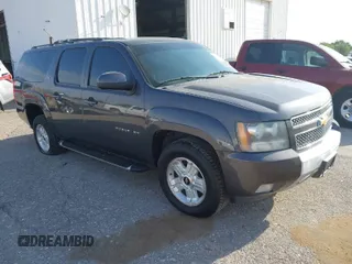 2011 Chevrolet Suburban LT with VIN 1GNSKJE34BR242629, listed as a IAAI auction lot 42043276 with 197,722 mi miles. Bid and sale history available at carsss.com. Image 1.