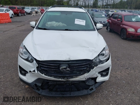 2016 Mazda CX-5 Touring with VIN JM3KE4CY0G0903723, listed as a IAAI auction lot 41966516 with 107,569 mi miles. Bid and sale history available at carsss.com. Image 6.