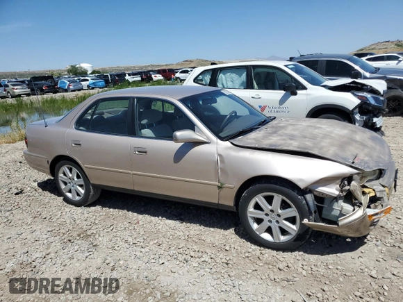 1996 Toyota Camry LE with VIN 4T1BF12K3TU132870, listed as a Copart auction lot 58052975 with 88,210 mi miles and Salvage title. Bid and sale history available at DreamBid. Image 4.