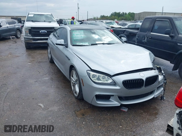 2015 BMW 6 Series 640i z VIN WBA6A0C51FD318982, wystawiony jako IAAI lot #41875547 z przebiegiem 60 968 mil mil oraz . Historia ofert i sprzedaży dostępna na DreamBid. Obrazek 1.