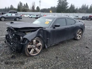 2006 Dodge Charger SRT-8 with VIN 2B3LA73W76H512508, listed as a Copart auction lot 86312114 with 177,592 mi miles and Salvage Title. Bid and sale history available at DreamBid. Image 1.