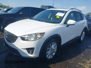 2014 Mazda CX-5 Grand Touring with VIN JM3KE2DY1E0424890, listed as a IAAI auction lot 42052437 with 107,793 mi miles. Bid and sale history available at carsss.com. Image 17.