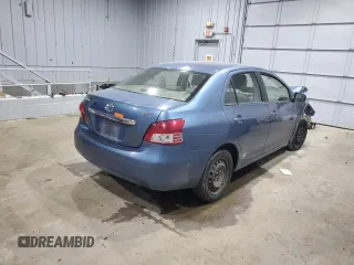 2009 Toyota Yaris with VIN JTDBT903094047243, listed as a Copart auction lot 47296455 with 235,483 mi miles and Salvage Title. Bid and sale history available at DreamBid. Image 3.