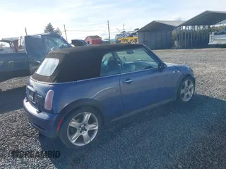 2005 MINI Convertible S with VIN WMWRH33455TF82408, listed as a IAAI auction lot 41857791 with 133,824 mi miles and . Bid and sale history available at DreamBid. Image 4.