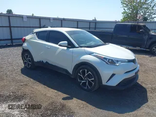 2018 Toyota C-HR XLE z VIN NMTKHMBXXJR041817, wystawiony jako IAAI lot #42174035 z przebiegiem 86 669 mil mil oraz . Historia ofert i sprzedaży dostępna na DreamBid. Obrazek 1.