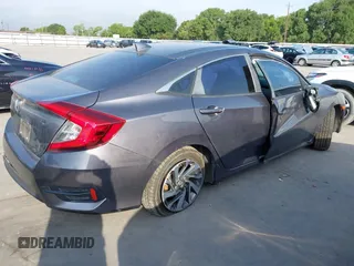 2017 Honda Civic EX z VIN 19XFC2F7XHE056273, wystawiony jako IAAI lot #42087934 z przebiegiem 95 871 mil mil oraz . Historia ofert i sprzedaży dostępna na DreamBid. Obrazek 4.