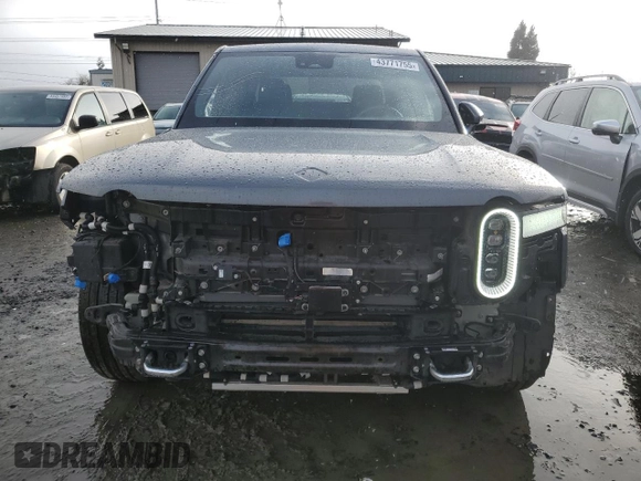 2022 Rivian R1T Adventure z VIN 7FCTGAAA5NN014941, wystawiony jako Copart lot #43771755 z przebiegiem 43 410 mil mil oraz Szkody całkowita. Historia ofert i sprzedaży dostępna na DreamBid. Obrazek 5.