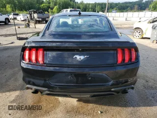 2021 Ford Mustang EcoBoost with VIN 1FA6P8THXM5112258, listed as a Copart auction lot 57501095 with 83,309 mi miles and Salvage title. Bid and sale history available at DreamBid. Image 6.