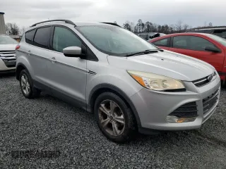 2015 Ford Escape SE with VIN 1FMCU0GX8FUB55610, listed as a Copart auction lot 48484695 with 138,687 mi miles and Salvage Title. Bid and sale history available at DreamBid. Image 4.