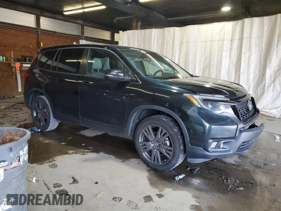 2020 Honda Passport EX-L with VIN 5FNYF8H57LB011549, listed as a Copart auction lot 59123735 with 127,797 mi miles and Salvage title. Bid and sale history available at DreamBid. Image 4.