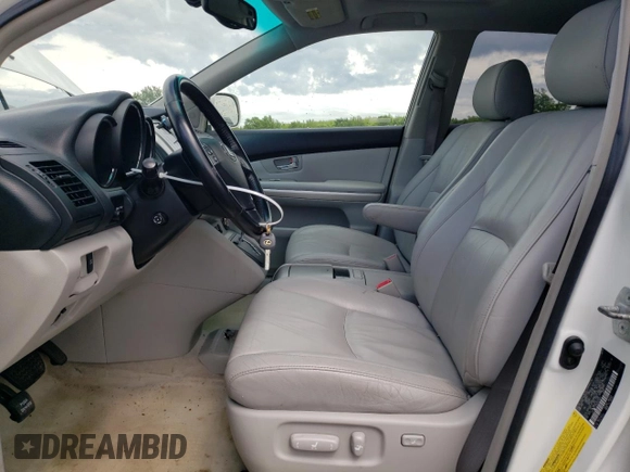 2006 Lexus RX 400h with VIN JTJHW31UX60023361, listed as a Copart auction lot 60489355 with 112,087 mi miles and Salvage title. Bid and sale history available at DreamBid. Image 7.