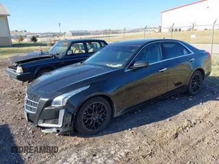 2014 Cadillac CTS Luxury AWD z VIN 1G6AX5SX9E0177017, wystawiony jako IAAI lot #42038429 z przebiegiem 113 656 mil mil oraz . Historia ofert i sprzedaży dostępna na DreamBid. Obrazek 2.