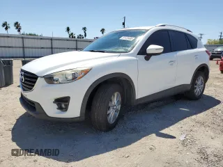 2016 Mazda CX-5 Sport z VIN JM3KE4BYXG0687414, wystawiony jako Copart lot #52122495 z przebiegiem 125 288 mil mil oraz Szkoda całkowita • Salvage title. Historia ofert i sprzedaży dostępna na DreamBid. Obrazek 1.