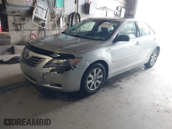 2007 Toyota Camry z VIN JTNBB46K973038138, wystawiony jako IAAI lot #42233680 z przebiegiem 230 480 mil mil oraz . Historia ofert i sprzedaży dostępna na DreamBid. Obrazek 2.