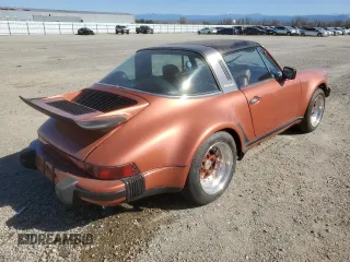 1974 Porsche 911 with VIN 9114111882, listed as a Copart auction lot 47080465 with 4,828 mi miles and Salvage title. Bid and sale history available at DreamBid. Image 3.