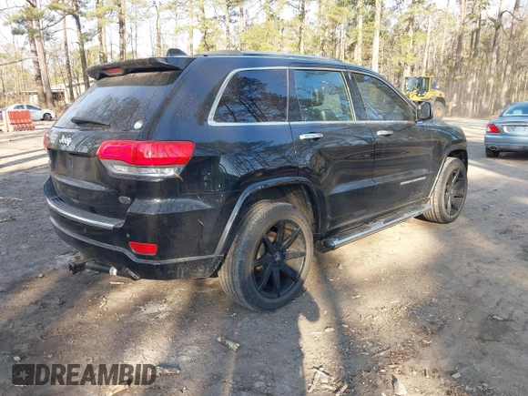 2015 Jeep Grand Cherokee Overland with VIN 1C4RJECGXFC957530, listed as a IAAI auction lot 41633522 with 168,258 mi miles and . Bid and sale history available at DreamBid. Image 4.
