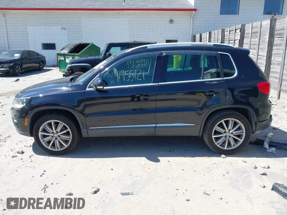 2012 Volkswagen Tiguan SEL with VIN WVGAV7AX2CW529232, listed as a IAAI auction lot 41955121 with 164,885 mi miles and . Bid and sale history available at DreamBid. Image 14.