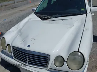 1999 Mercedes-Benz E-Class with VIN WDBJF82H4XX025925, listed as a IAAI auction lot 41839398 with 238,583 mi miles. Bid and sale history available at carsss.com. Image 6.