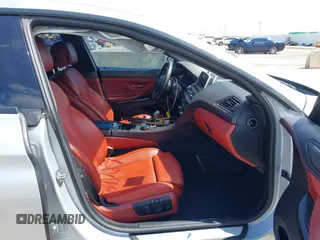2015 BMW 6 Series 650i z VIN WBA6B2C55FGB99196, wystawiony jako IAAI lot #42107698 z przebiegiem 74 393 mil mil oraz . Historia ofert i sprzedaży dostępna na DreamBid. Obrazek 5.