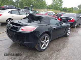 2009 Saturn Sky z VIN 1G8MN35B59Y104152, wystawiony jako IAAI lot #42308236 z przebiegiem 190 823 mil mil oraz . Historia ofert i sprzedaży dostępna na DreamBid. Obrazek 4.