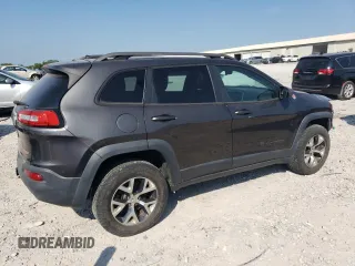 2014 Jeep Cherokee Trailhawk with VIN 1C4PJMBS1EW304718, listed as a Copart auction lot 64105485 with 151,315 mi miles and Salvage title. Bid and sale history available at DreamBid. Image 3.