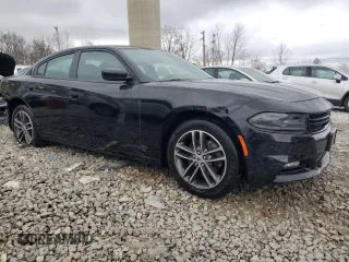 2019 Dodge Charger SXT with VIN 2C3CDXJG9KH523879, listed as a Copart auction lot 82988364 with 71,386 mi miles and Salvage Title. Bid and sale history available at DreamBid. Image 4.