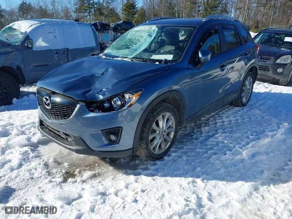 2015 Mazda CX-5 Grand Touring with VIN JM3KE4DY1F0541592, listed as a IAAI auction lot 41585018 with 113,016 mi miles. Bid and sale history available at carsss.com. Image 2.