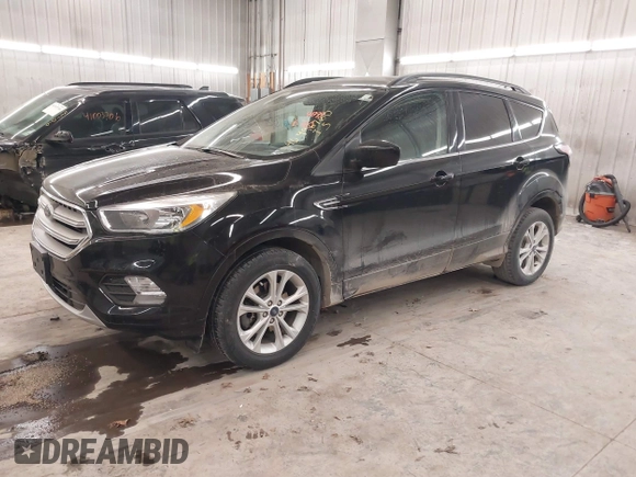 2018 Ford Escape SE z VIN 1FMCU9GD0JUC25636, wystawiony jako IAAI lot #40996760 z przebiegiem 70 097 mil mil oraz . Historia ofert i sprzedaży dostępna na DreamBid. Obrazek 18.