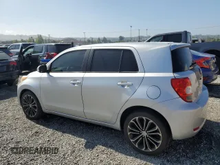 2010 Scion xD with VIN JTKKU4B40A1005613, listed as a Copart auction lot 56074605 with 205,505 mi miles and Clean Title. Bid and sale history available at DreamBid. Image 2.