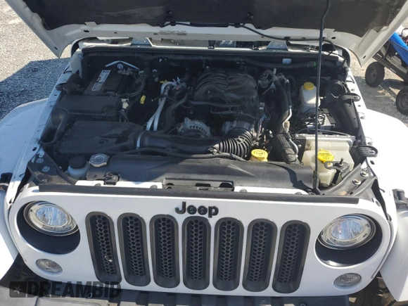 2015 Jeep Wrangler Unlimited Sahara with VIN 1C4BJWEG3FL584920, listed as a Copart auction lot 61843525 with 62,876 mi miles and Salvage title. Bid and sale history available at DreamBid. Image 12.